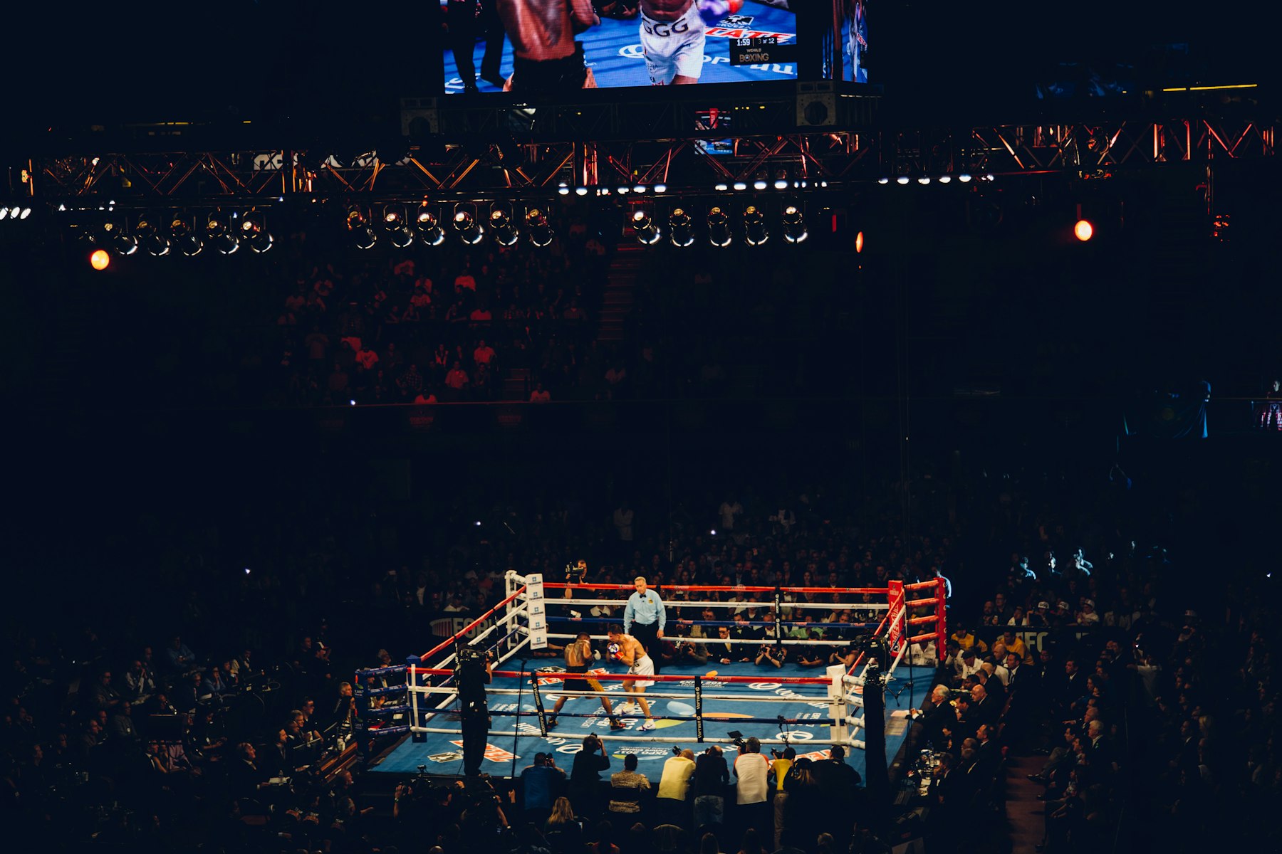 Boxer under arena lights during a marquee fight card